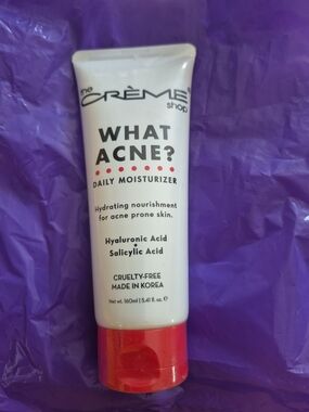 The Crème Shop What Acne? Daily Moisturizer – White Tube with Red Cap